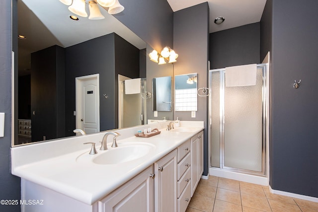 bathroom with tile patterned flooring, vanity, and an enclosed shower