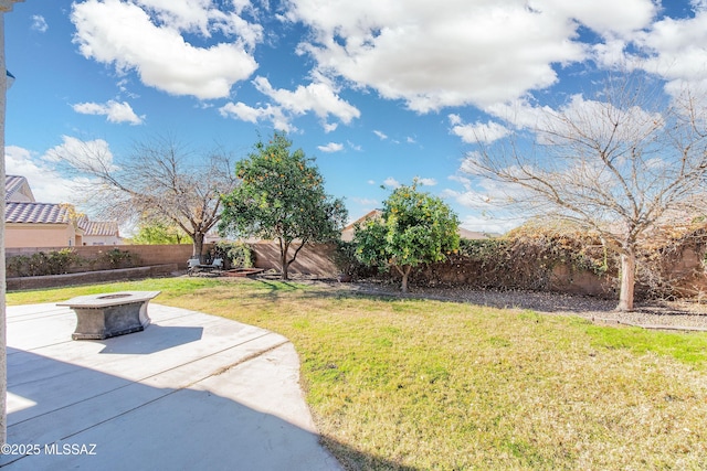 view of yard with a patio and a fire pit