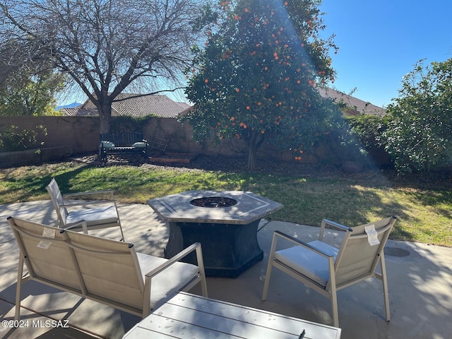 view of patio / terrace with a fire pit