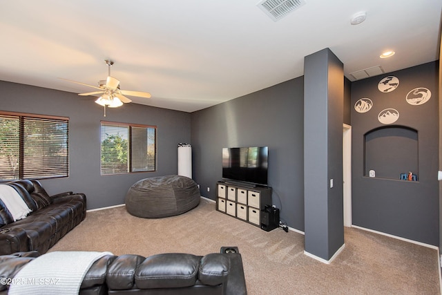 living room with carpet and ceiling fan