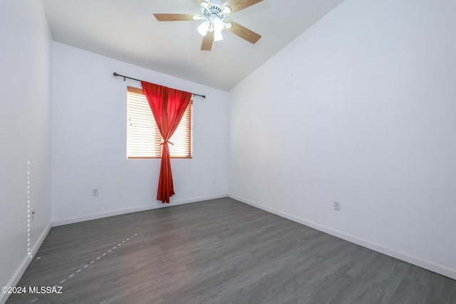 unfurnished room with dark hardwood / wood-style floors, vaulted ceiling, and ceiling fan