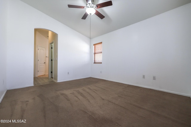 unfurnished room with carpet, vaulted ceiling, and ceiling fan