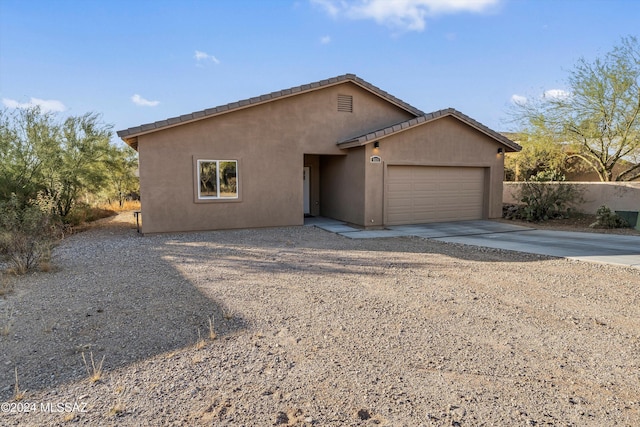 single story home featuring a garage