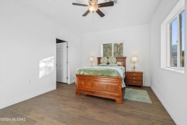 bedroom featuring dark hardwood / wood-style flooring and ceiling fan