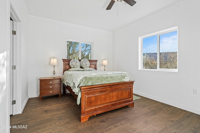 bedroom with ceiling fan and dark wood-type flooring