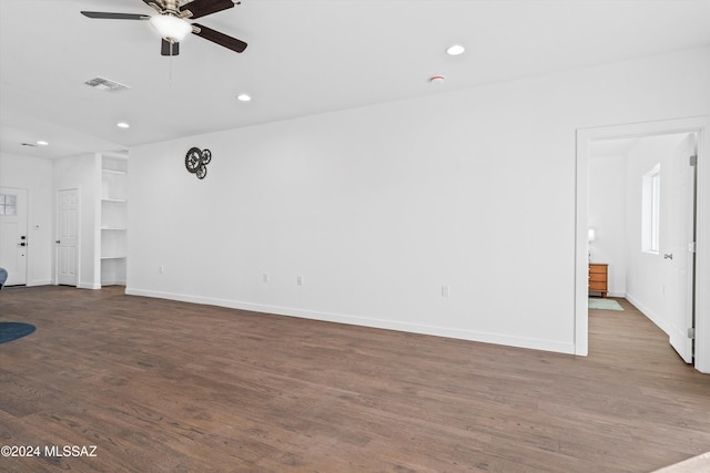 unfurnished living room featuring hardwood / wood-style floors and ceiling fan