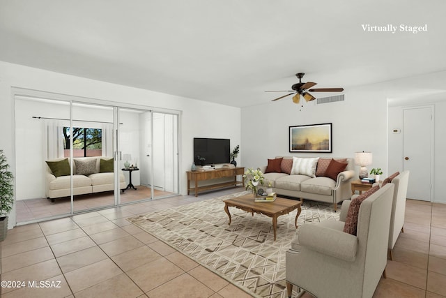 living room with light tile patterned floors and ceiling fan