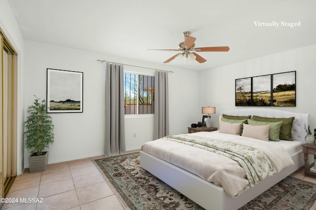 bedroom featuring ceiling fan and light tile patterned flooring