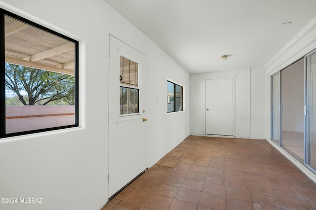 hallway with light tile patterned floors