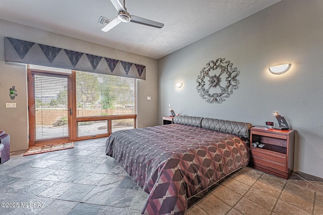 bedroom featuring ceiling fan and access to exterior