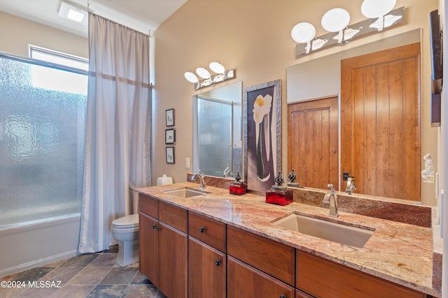 full bathroom with shower / bath combination with curtain, vanity, and toilet