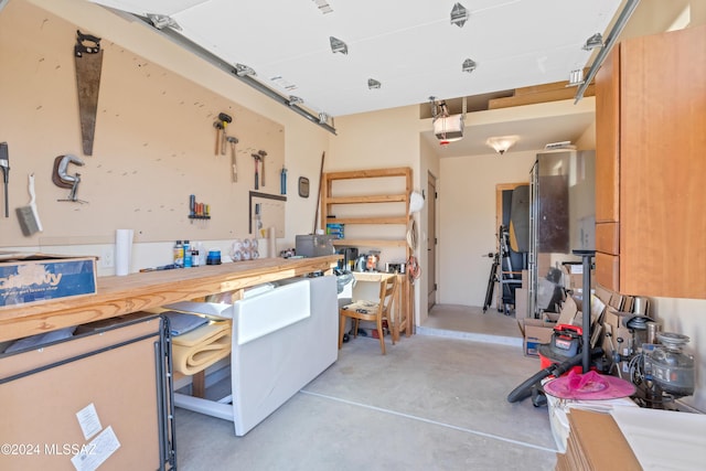 garage featuring a garage door opener and a workshop area