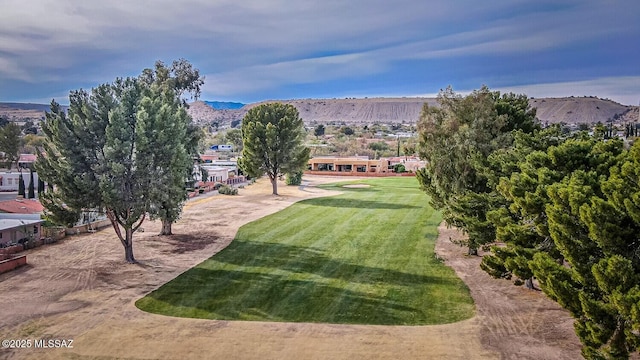 exterior space with a yard and a mountain view