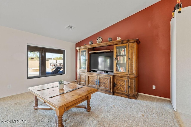 living room with light carpet and lofted ceiling