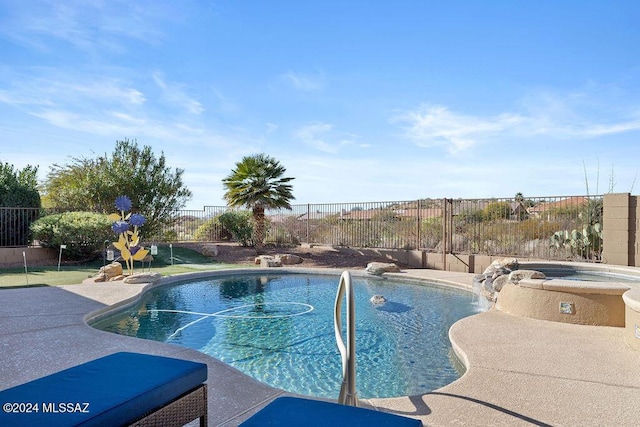 view of swimming pool featuring an in ground hot tub