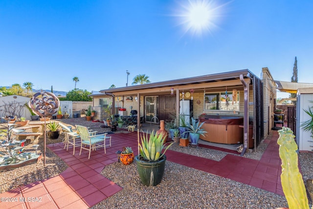 view of patio featuring a hot tub