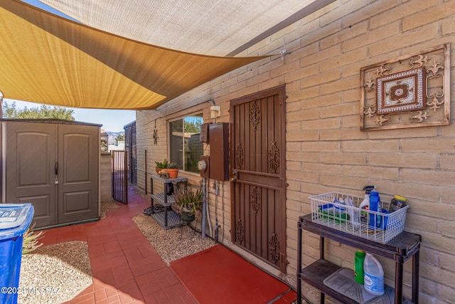 view of patio / terrace featuring a shed