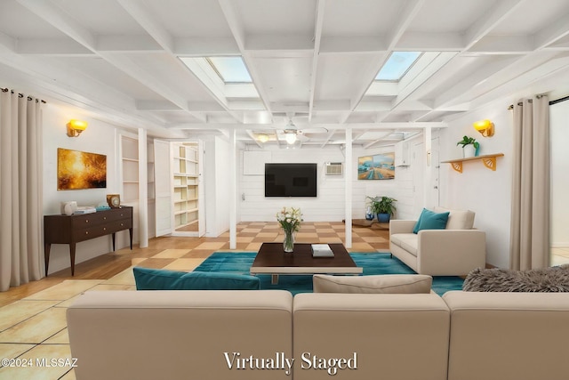 living room featuring beam ceiling, ceiling fan, and coffered ceiling