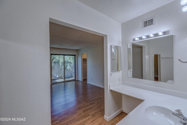 bathroom with wood-type flooring and vanity