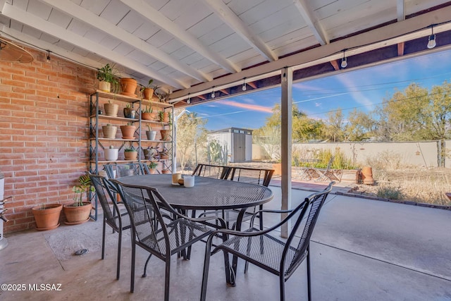 view of patio / terrace featuring a shed