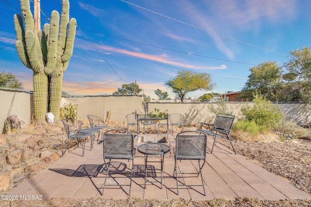 view of patio / terrace with an outdoor fire pit