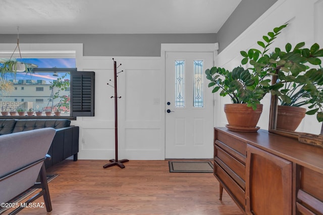 entryway with hardwood / wood-style flooring