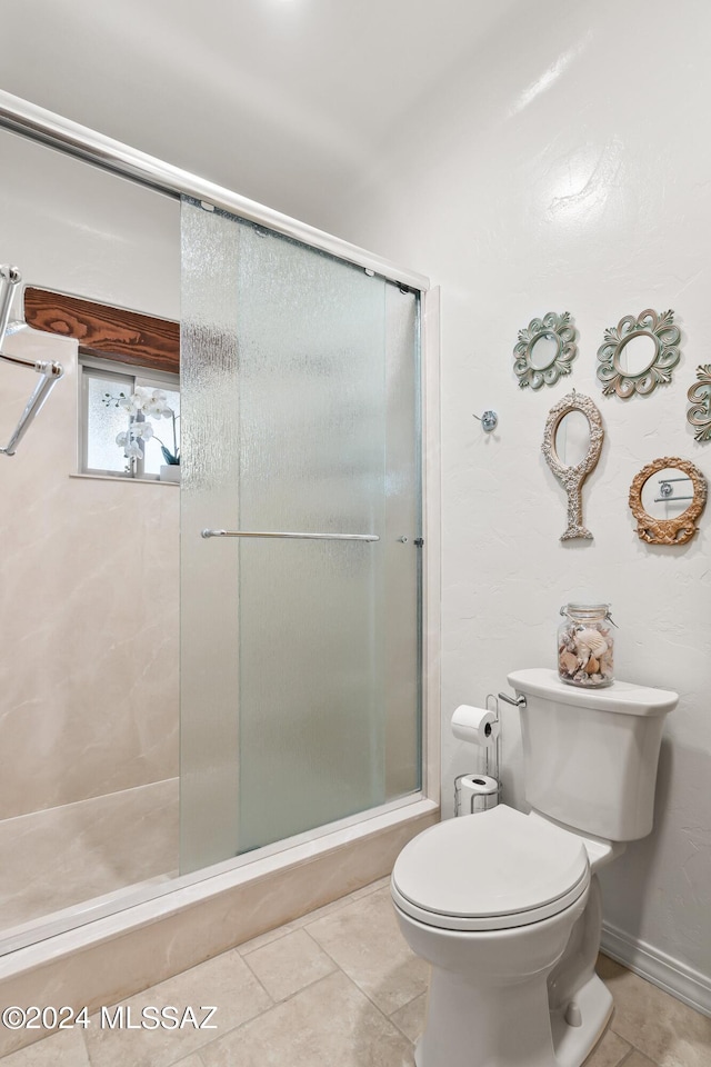 bathroom with toilet and walk in shower