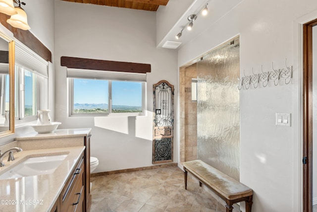 bathroom with a wealth of natural light, a shower, and vaulted ceiling