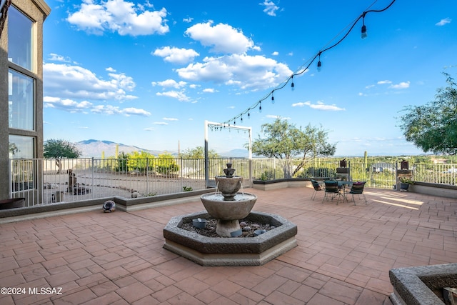 view of patio / terrace with a mountain view