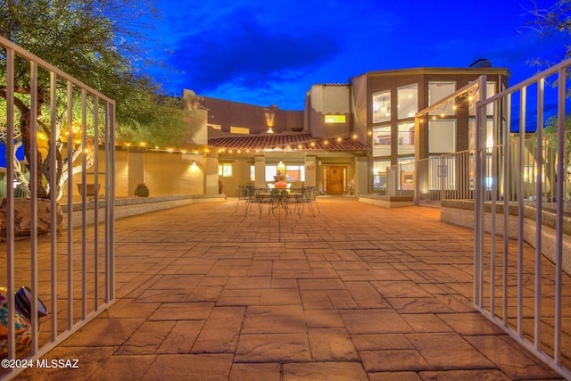 view of patio terrace at dusk