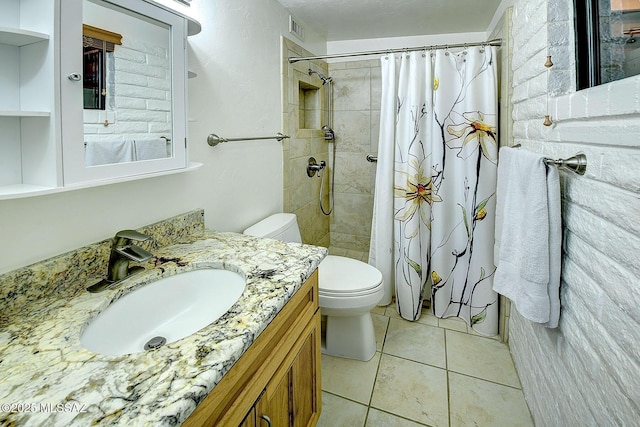 bathroom with tile patterned floors, vanity, curtained shower, and toilet