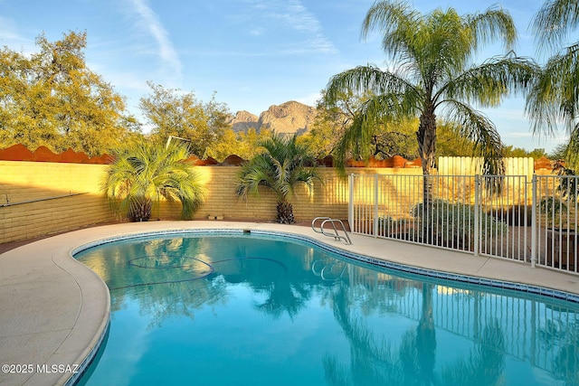 view of pool with a mountain view