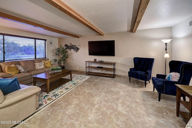 living room featuring beamed ceiling