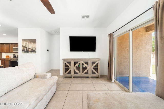 living room with light tile patterned floors and ceiling fan