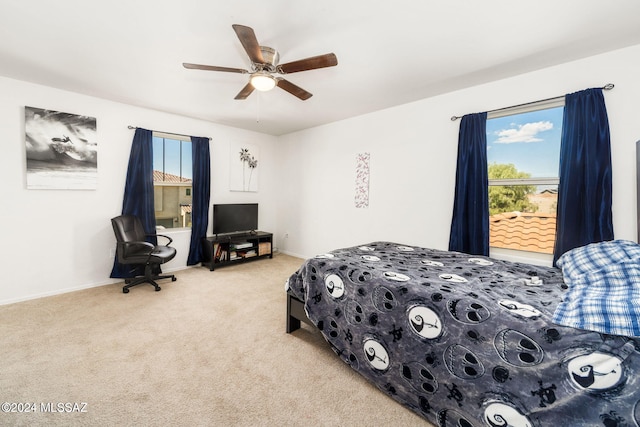 carpeted bedroom featuring ceiling fan