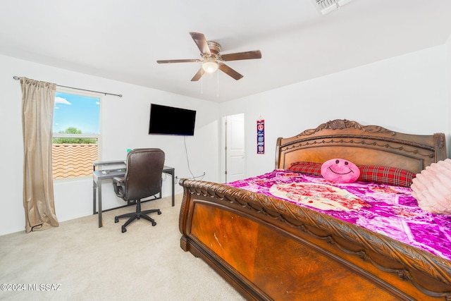 bedroom with light carpet and ceiling fan