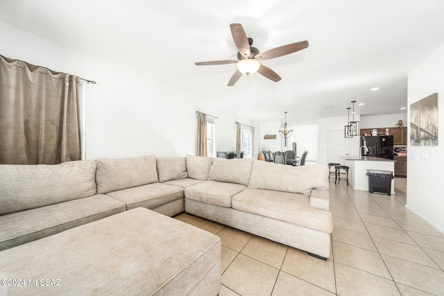 tiled living room featuring ceiling fan