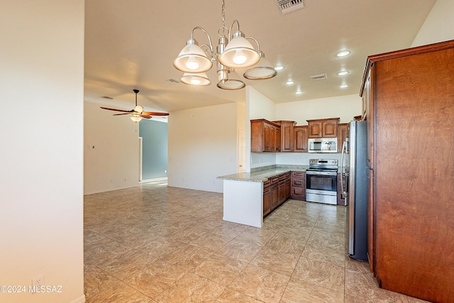 kitchen featuring ceiling fan with notable chandelier, light stone countertops, and stainless steel appliances