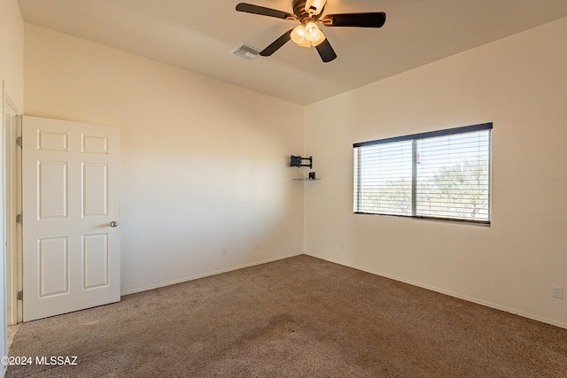 unfurnished room featuring ceiling fan and carpet