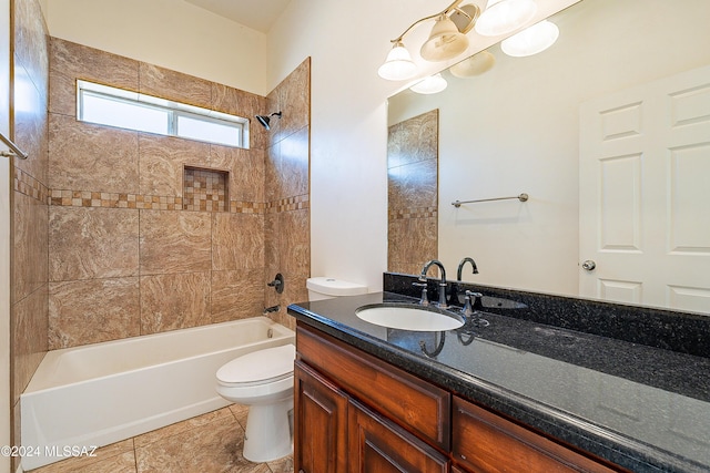 full bathroom with tile patterned floors, vanity, toilet, and tiled shower / bath