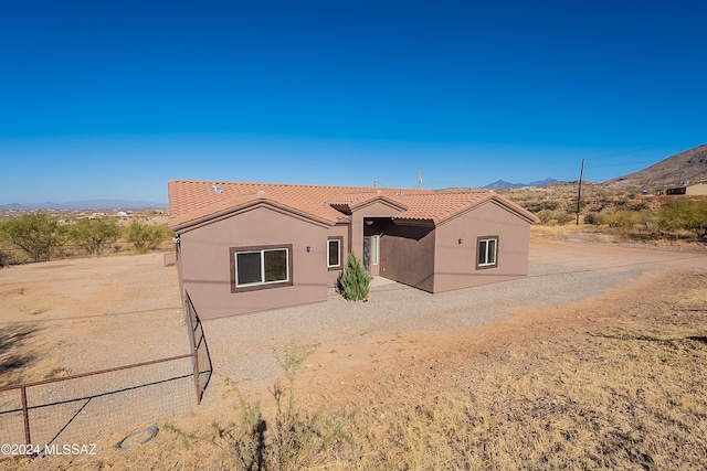 view of front of home with a mountain view