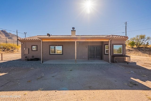 rear view of property with a patio