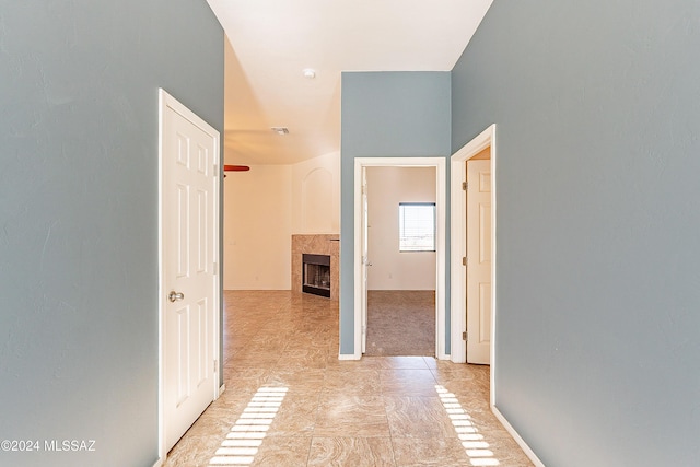 hallway with light tile patterned floors