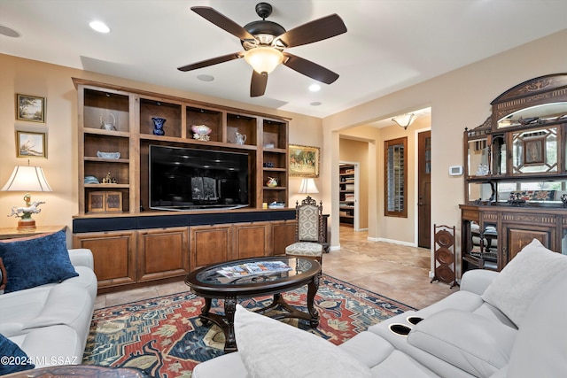 living room with light tile patterned floors and ceiling fan