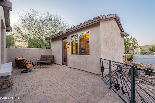 patio terrace at dusk with outdoor lounge area