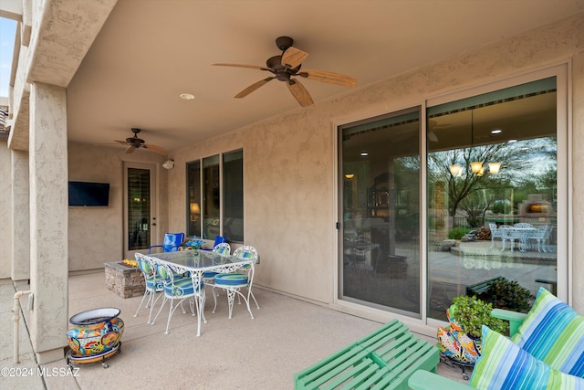 view of patio featuring ceiling fan