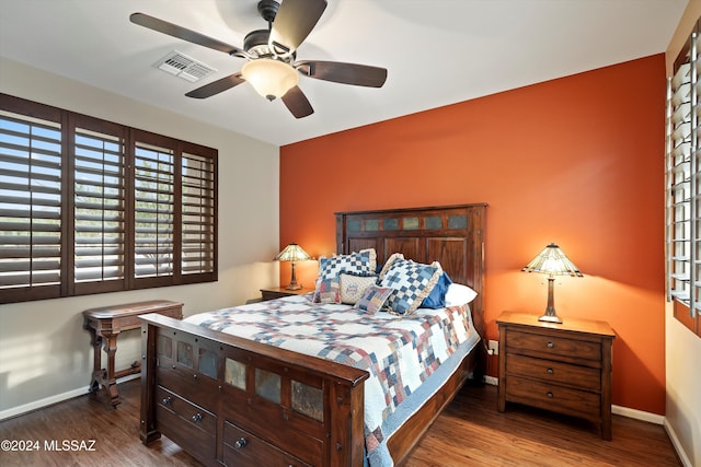 bedroom featuring hardwood / wood-style flooring and ceiling fan