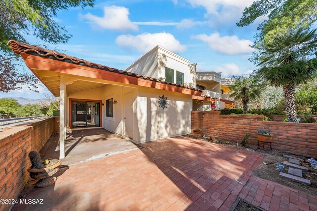 entrance to property with a balcony