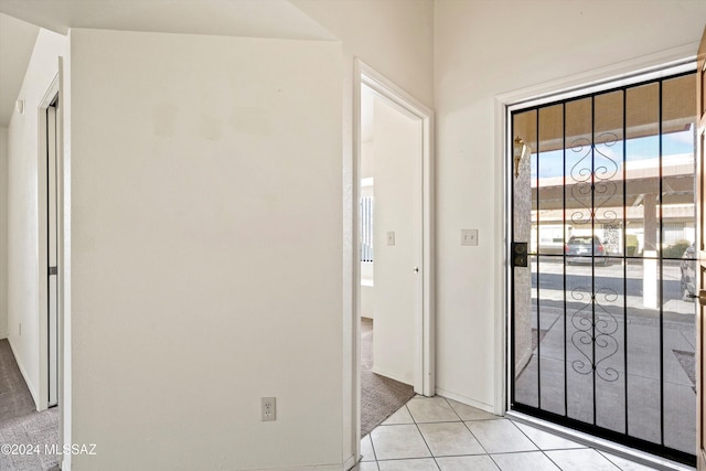 entryway with light tile patterned floors