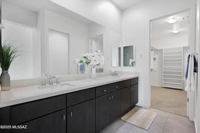 bathroom with tile patterned floors and vanity